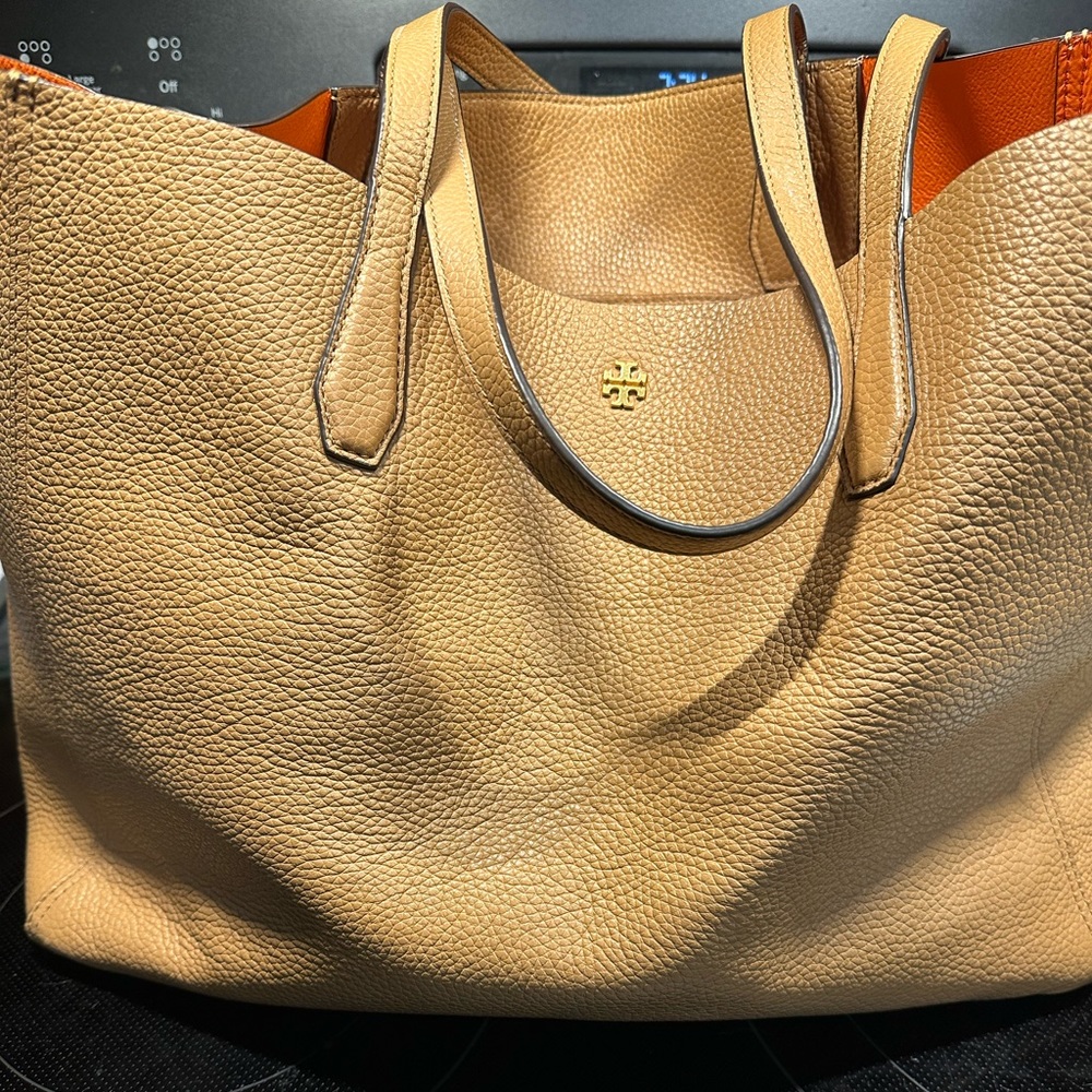 Tory Burch shoulder Bag, tan with orange lining.  It has a detachable clutch.